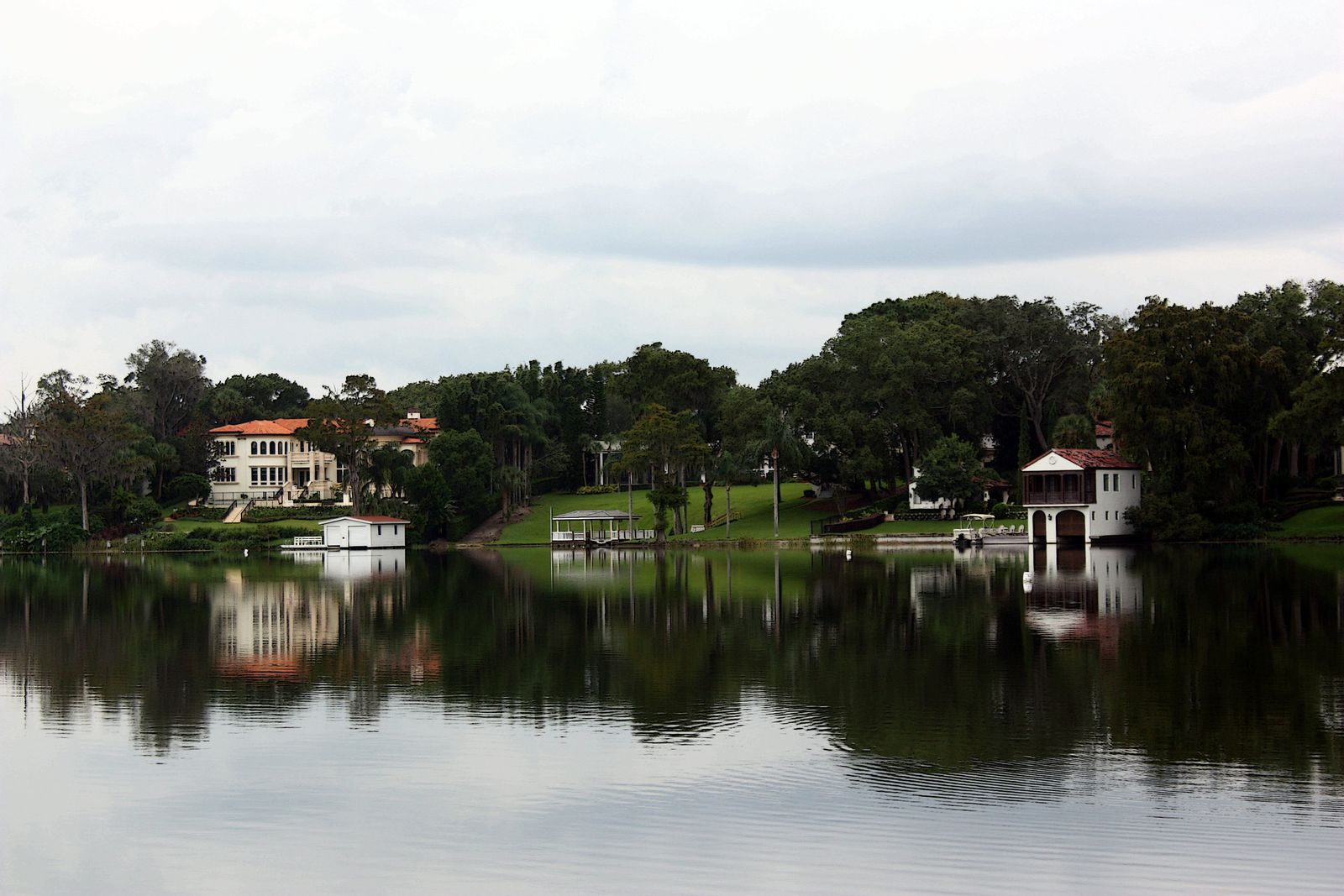 Calm water and oak-lined shoreline on Lake Maitland, Winter Park